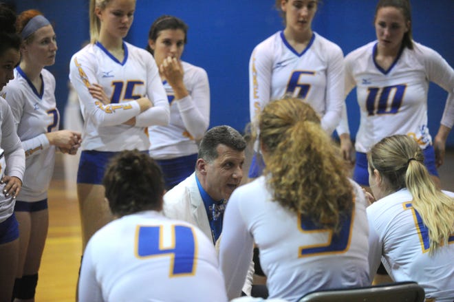 Lake Superior State volleyball coach Dave Schmidlin talks to the team during a match at the Bud Cooper Gym. The Lakers' 2019 schedule has been released. [LSSU photo]