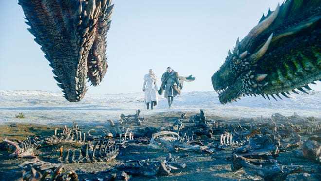 This image released by HBO shows Emilia Clarke, left, and Kit Harington in a scene from the final episode of "Game of Thrones." On Tuesday, July 16, 2019, the program was nominated for an Emmy Award for outstanding drama series. (HBO via AP)