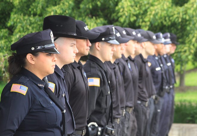 Herkimer College graduated its first pre-employment police basic training program cadets on June 1, which included the first female graduate from the program. Pictured is Meagan Bedell, with her fellow cadets, during the June 1 commencement ceremony. [PHOTO COURTESY HERKIMER COLLEGE]