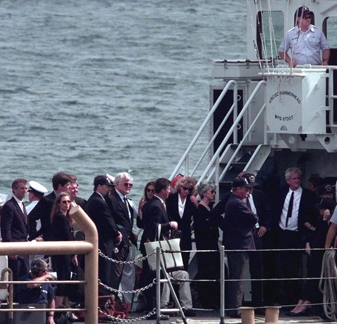 Kennedy and Bessette family members return to the Coast Guard station at Woods Hole on July 22, 1999, after scattering the ashes of John F. Kennedy Jr., wife Carolyn Bessette Kennedy and her sister Lauren Gail Bessette. Twenty years ago today, the three died when the plane piloted by Kennedy crashed off Martha's Vineyard. [Jim Cole/Associated Press file]