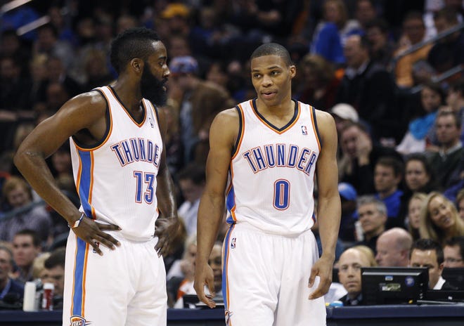 In this January 2012 photo, James Harden, left, and Russell Westbrook are shown playing for the Oklahoma City Thunder. The two all-stars will be back together this season, this time with the Houston Rockets. [AP Photo/Sue Ogrocki]