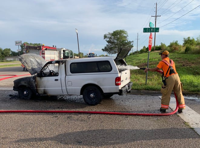 Crews sprayed water into a Ford Ranger pickup truck that caught fire early Tuesday in the 5200 block of S.W. Topeka Boulevard. [Phil Anderson/The Capital-Journal]