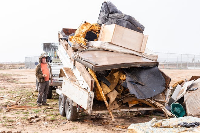 Victorville residents are invited to dispose of old furniture, toilets, mattresses, appliances and other trash during a free dump day set for Saturday. Shown here, the High Desert Keepers clean up illegally dumped trash near Baldy Mesa. [Daily Press file photo]