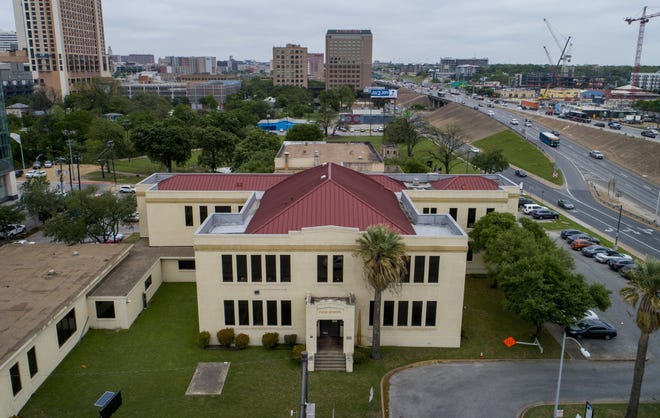 Travis County owns the historic Palm School, near the corner of Cesar Chavez Street and Interstate 35. Preservationists have pushed to keep the building public and the land around it vacant. [JAY JANNER / AMERICAN-STATESMAN]