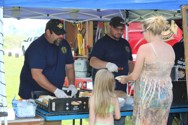 Each year, the Cheboygan Fire Department hosts their Kids Picnic at City Beach, where they hand out hundreds of hot dogs, chips and drinks to children and their families. It is the fire department's way of putting on an event the whole family can enjoy. Tribune File Photo