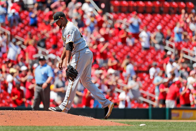 Pittsburgh Pirates relief pitcher Michael Feliz walks back to the mound after giving up a three-run home run to St. Louis Cardinals' Paul Goldschmidt during the seventh inning of a baseball game Wednesday, July 17, 2019, in St. Louis. (AP Photo/Jeff Roberson)