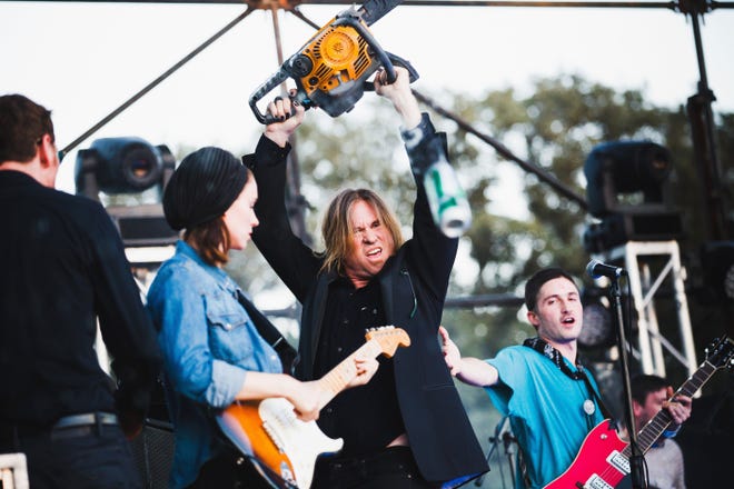 Rooney Mara (left), Val Kilmer (center) and Black Lips guitarist Cole Alexander on the Blue Stage at Fun Fun Fun Fest in 2012. This happened and we let it happen. [Contributed by Pooneh Ghana.]