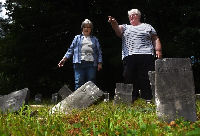 Somersworth cemetery trustees Mary Shaw, left, and Maggie Roberge are helping lead a project to upright, repair and clean fallen headstones at Forest Glade Cemetery, which was added to the National Register of Historic Places in 2017. [Deb Cram/Fosters.com]