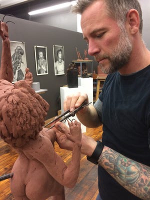 Sculptor Erik Durant attends to a sculpture underway in his Hatch Street studio. [Don Wilkinson/The Standard-Times/Special]