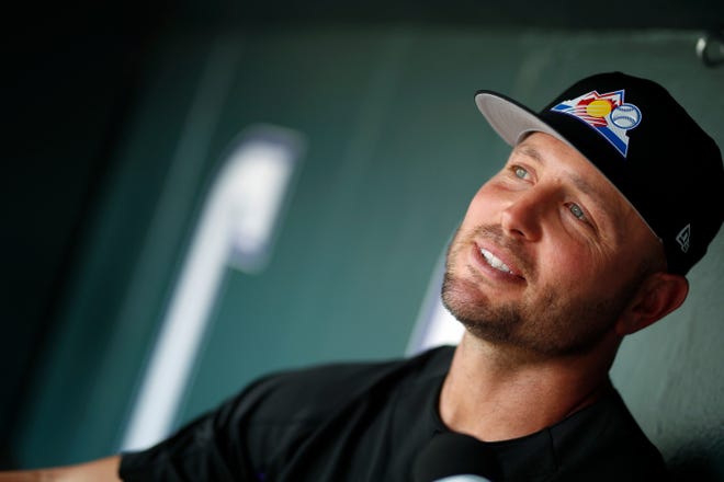 Colorado Rockies left fielder Matt Holliday considers a question from a television reporter during an interview before a baseball game against the St. Louis Cardinals, Friday, Aug. 24, 2018, in Denver. (AP Photo/David Zalubowski)
