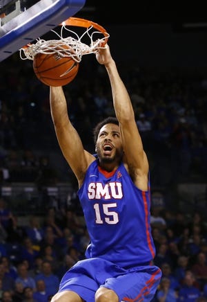 Former SMU center Cannen Cunningham, seen here dunking in a 2015 game at Tulsa, recently joined the OSU coaching staff. [AP Photo/Alonzo Adams]