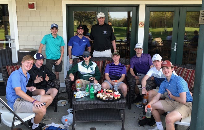 Oyster River Golf Team members with coach Paul Bamford. The team recently raised more than $26,000 for Exeter Hospital’s Center for Cancer Care through the Chris Bamford Memorial Golf Run.