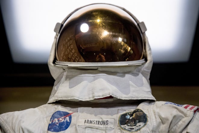 Neil Armstrong's Apollo 11 spacesuit is unveiled at the Smithsonian's National Air and Space Museum on the National Mall in Washington D.C. on Tuesday. (AP Photo/Andrew Harnik)