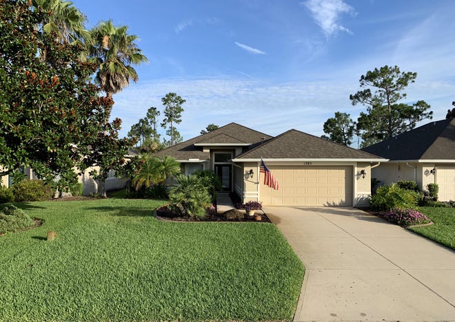 Located on the 5th-tee box of the Prestwick Golf Course in the prestigious community of Plantation Bay, this beautiful Captiva model has great curb appeal in the front and a pool out back. [Adams, Cameron & Co. Realtors]