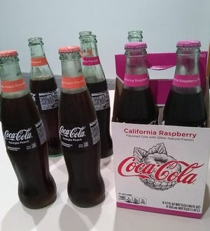 Sentinel employees had their own taste test with two Coca-Cola flavors: California Raspberry and Georigia Peach. [LORI TIMMER/SENTINEL STAFF]