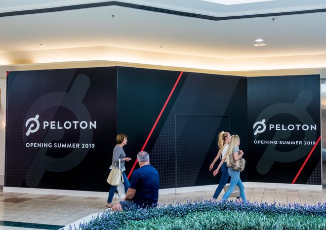 Guests walk past the future location of the Peleton store inside The Gardens Mall on May 20, 2019 in Palm Beach Gardens. [RICHARD GRAULICH/palmbeachpost.com]