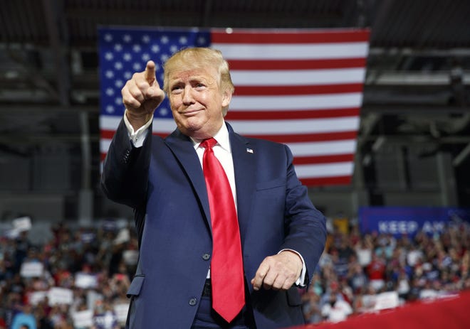 President Donald Trump gestures to the crowd as he arrives to speak at a campaign rally at Williams Arena in Greenville, N.C., Wednesday, July 17, 2019. [AP Photo/Carolyn Kaster]