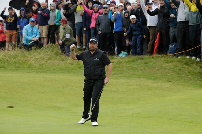 Ireland's Shane Lowry celebrates after making a birdie at the 10th hole during the second round of the British Open at Royal Portrush on Friday in Northern Ireland. Lowry and J.B. Holmes are tied for the lead after two rounds. [Matt Dunham/The Associated Press]