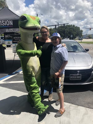 Veteran Jada O’Brien and her son receive a refurbished car donated by Geico in Venice on July 17, 2019. [SUBMITTED PHOTO]