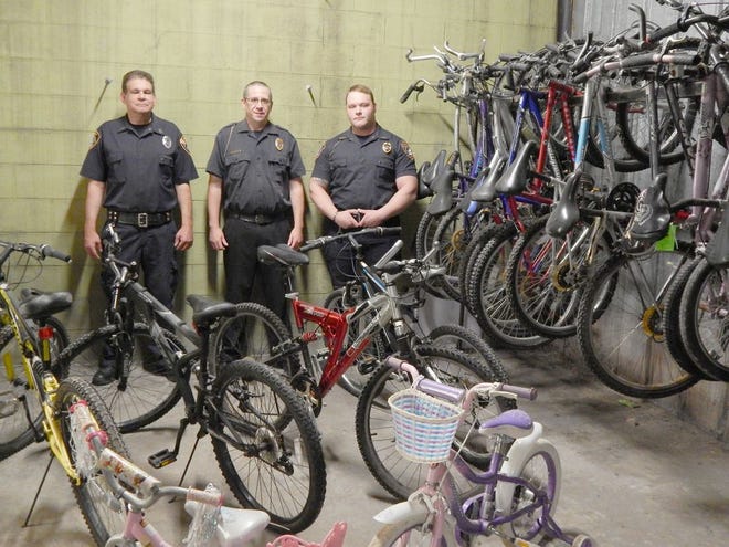 Mike Wendlowsky, Dennis Sparks and Andrew Selke of the Sault Auxiliary Police pose with some of the inventory as they prepare for Saturday’s bike auction. Viewing opens at 9:30 a.m. with the first bike going on the block at 10:30 a.m. All proceeds raised will be split between Road to Recovery and Hospice of the EUP. (Scott Brand/The Sault News)