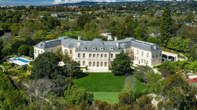 The Manor, a 56,500-square-foot chateau in Holmby Hills, has sold for $119.75 million — the highest home price in Los Angeles County history. The "W"-shaped mansion has 123 rooms, including 14 bedrooms and 27 bathrooms. [Jim Bartsch / TNS]