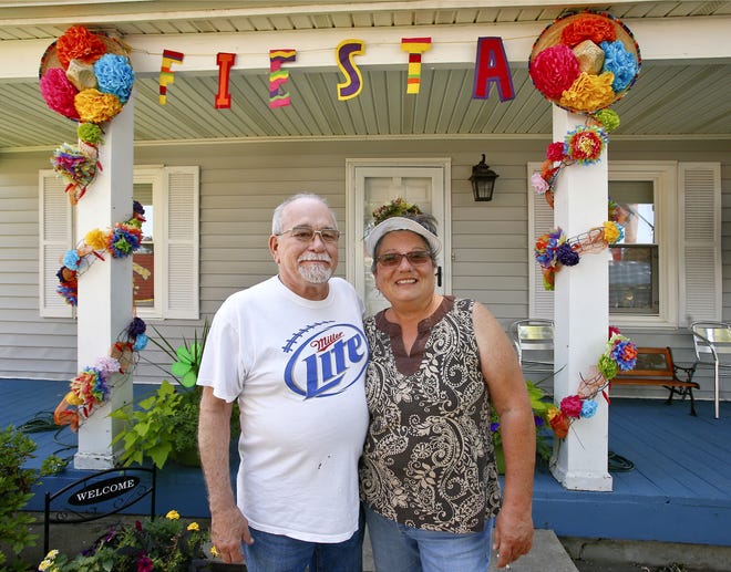 Adrian and Tish Alcala have been decorating their house during Fiesta Mexicana for about 20 years. [Chris Neal/The Capital-Journal]