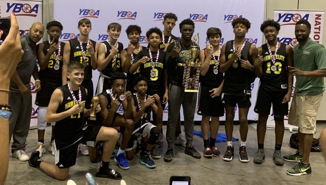 Marcel Thomas, far right, celebrates with his Minneola Elite 2023 team that won the Youth Basketball of America Division II national title earlier this month at the Orange County Convention Center. [Submitted]