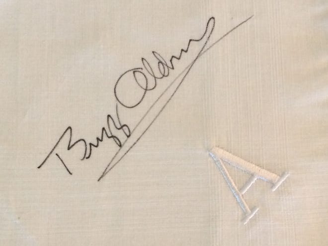 Apollo 11 lunar module pilot Edwin "Buzz" Aldrin signed a handkerchief in the collection of Hutchinson-area resident Ann M. Richardson. [MARY CLARKIN/HUTCHNEWS]