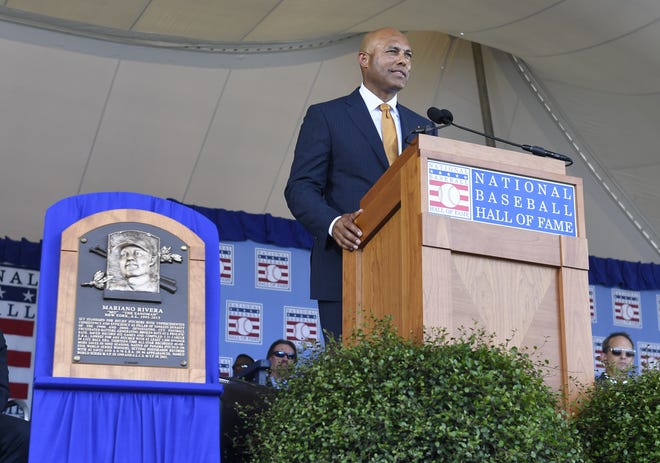 Former New York Yankees pitcher and National Baseball Hall of Fame inductee Mariano Rivera speaks during the induction ceremony at the Clark Sports Center on Sunday in Cooperstown, N.Y. [The Associated Press / Hans Pennink]