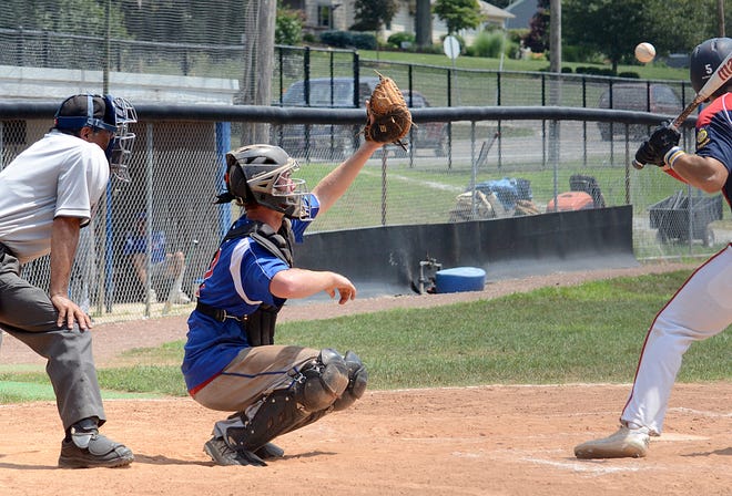 Cambridge Post 84 catcher Clarke Jennings prepares to haul in the high pitch during District 11 American Legion tournament action against St. Clairsville Post 159 Sunday afternoon.