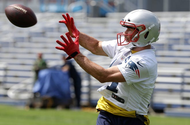 New England Patriots wide receiver Julian Edelman makes a catch during an NFL football training camp, Thursday, June 6, 2019, in Foxborough, Mass. (AP Photo/Steven Senne)