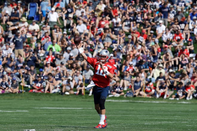 New England Patriots quarterback Tom Brady throws during the team's NFL football training camp in Foxborough, Friday, July 27, 2018. (AP Photo/Charles Krupa)