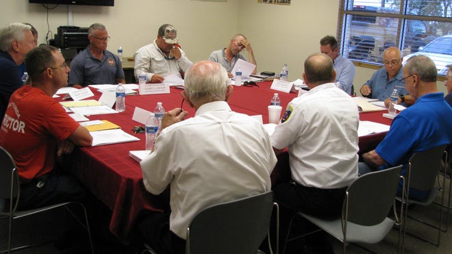 The boards of the Myakka City and East Manatee fire districts discuss a proposed merger during a July 22, 2019 joint meeting. [Herald-Tribune staff photo / Dale White]