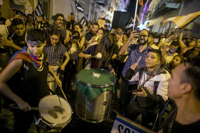 Demonstrators gather during a protest calling for the resignation of Gov. Ricardo Rossello in San Juan, Puerto Rico, on 21, 2019. MUST CREDIT: Bloomberg photo by Xavier Garcia.