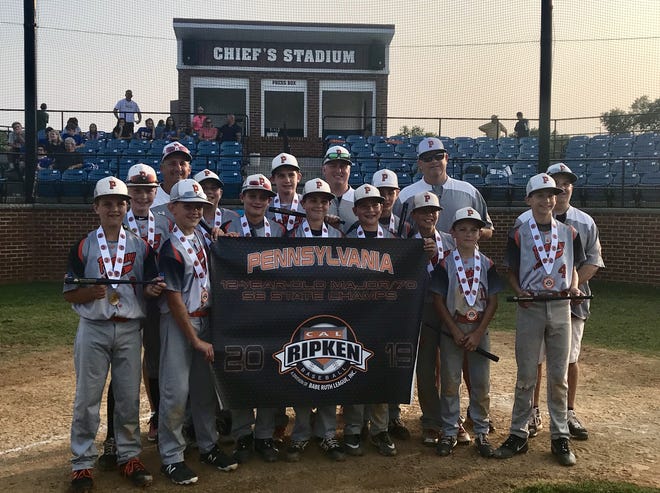 Members of the Pennsbury 12-Year-Old Major/70 Cal Ripken Southeastern Pennsylvania state champions pose after winning the title. Pennsbury went on to take the 2019 Keystone Cup by defeating the Northwest PA champ and reached the semifinals of the Middle Atlantic Regional Tournament. Team players included Ryan Forester, Ryan Webber, Carter Gabbett, Jonathan Gilkeson, Ben Seidler, Connor McCloskey, KJ Freiband, Dylan Hirsh, Kerrick Shannon, Evan Hawkes, John Luchansky and Danny Cohen. Greg Webber was the manager, with assistant coaches Brian McCloskey, Mike Gabbett and Ed Hirsh. [CONTRIBUTED]