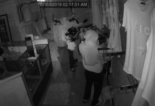 Two people are seen breaking into and stealing merchandise from Bossy Boutique in Daytona Beach in this surveillance video. Daytona Beach police are asking for the public's help identifying them. [Daytona Beach Police Department]