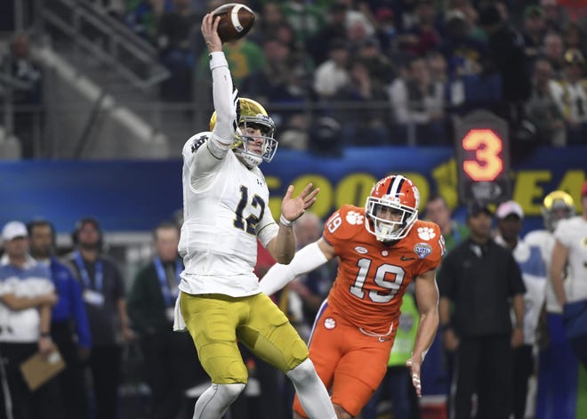 Clemson defensive back Tanner Muse looks to deliver a blow to Notre Dame quarterback Ian Book during last December's Cotton Bowl. [Associated Press photo]
