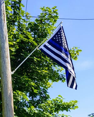 A Blue Lives Matter flag, put up on a York Street telephone pole by the family of Trooper Charles Black who was killed in the line of duty 55 years ago this month, has been taken down after concerns that it could be sending a racially charged message. 

[Deborah McDermott/Seacoastonline]