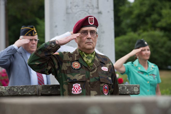 Army veteran Dick Dillon of Wellesley salutes during the Memorial Day observance on May 30, 2016. (Wicked Local file Photo / Anna Miller)