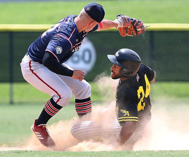 Gastonia's Michael Brown tries to slide in ahead of a throw by a High Point-Thomasville fielder during a game earlier this season. [JOHN CLARK/Gaston Gazette]