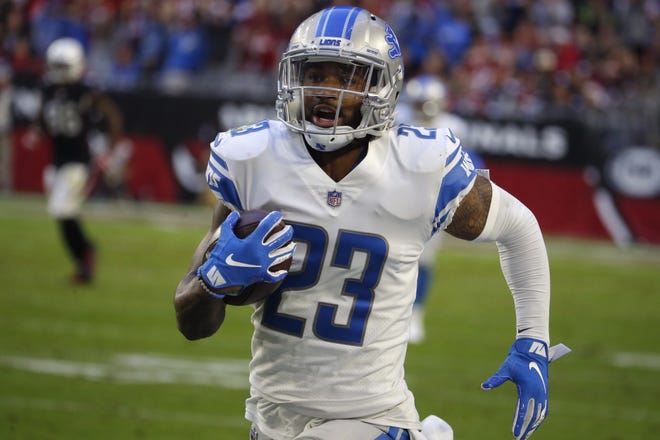 FILE - In this Dec. 9, 2018, file photo, Detroit Lions cornerback Darius Slay (23) runs against the Arizona Cardinals during an NFL football game in Glendale, Ariz. Detroit Lions defensive coordinator Paul Pasqualoni says cornerback Darius Slay and defensive tackle Damon "Snacks" Harrison have reported to camp. They showed up Wednesday, July 24, 2019, with their teammates, the day before DetroitþÄôs first practice.(AP Photo/Rick Scuteri, File)