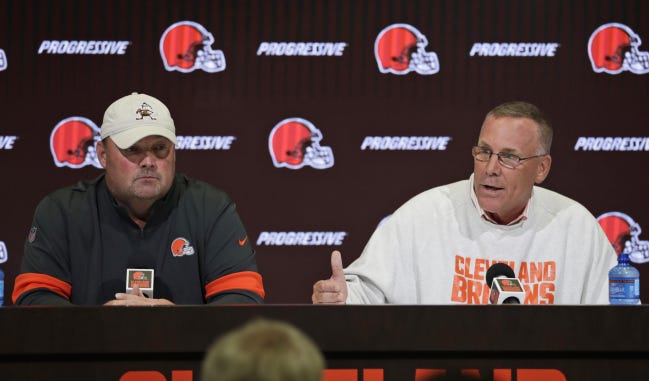 Cleveland Browns general manager John Dorsey, right, and coach Freddie Kitchens answer questions during a news conference Wednesday in Berea, Ohio. [AP Photo/Tony Dejak]