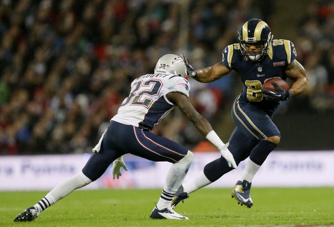 St. Louis Rams tight end Lance Kendricks, right, in action with New England Patriots cornerback Devin McCourty, during the first half of a NFL football game at Wembley Stadium, London, Sunday, Oct. 28, 2012.