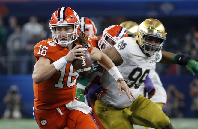 Clemson quarterback Trevor Lawrence (16) led the Tigers to their third national title in school history last year as a true freshman. [AP Photo/Michael Ainsworth]