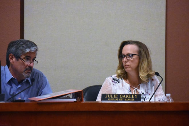 Lakeway City Manager Steve Jones and Assistant City Manager Julie Oakley present a balanced budget to the City Council on July 15. Although balanced, the budget would necessitate increasing the city's tax rate. [Photo by Leslee Bassman]
