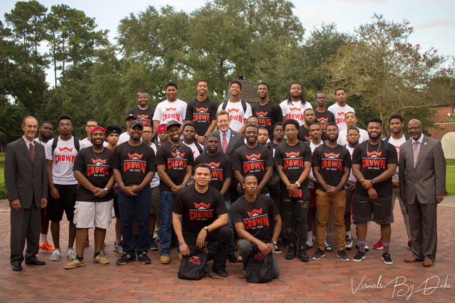 The mentors and students of Nicholls State University's first CROWN program class pose for a photo. [Submitted]