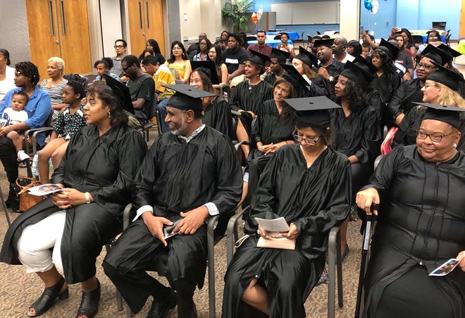 Participants in the ReGeneration IT program received certificates of completion in a graduation ceremony Thursday at Florida State College at Jacksonville. [Photo courtesy of Generation]