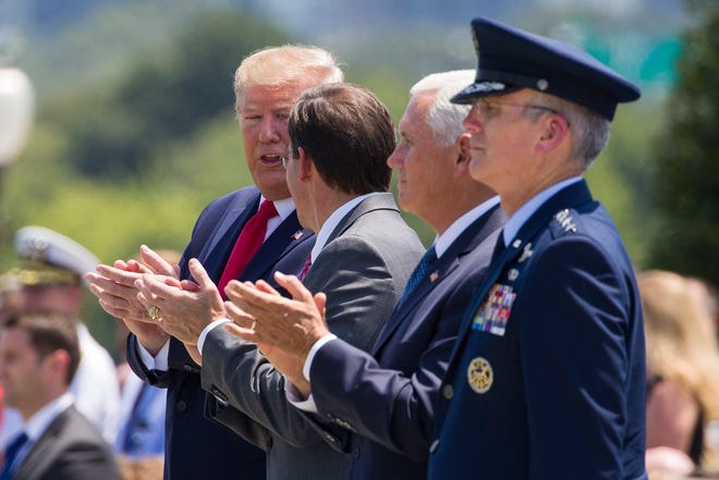 President Donald Trump, left, applauds accompanied by Defense Secretary Mark Esper, Vice President Mike Pence, and Joint Chiefs Vice Chairman Gen. Paul Selva, during a full honors welcoming ceremony for Secretary of Defense Mark Esper at the Pentagon, Thursday, July 25, 2019, in Washington. (AP Photo/Alex Brandon)