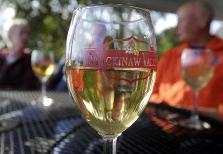 In this file photo, Mackinaw Valley Vineyard wine is shared among visitors to the winery. RON JOHNSON | GATEHOUSE MEDIA ILLINOIS FILE PHOTO