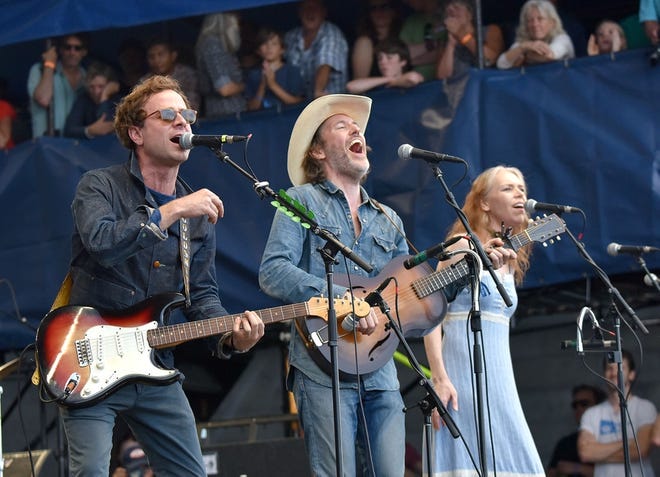 Dawes frontman Taylor Goldsmith, left, plugs in to Bob Dylan's old Fender guitar and joins David Rawlings and Gillian Welch for "Maggie's Farm" on the Fort stage to close out the 2015 Newport Folk Festival, which marked the 50th anniversary of Dylan's "going electric" performance. [Newport Daily News, file]